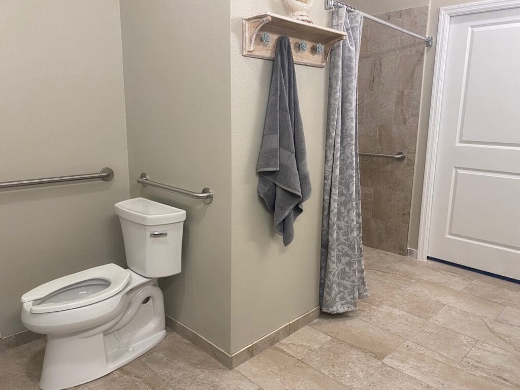Resident's private bathroom at Palm Bay Memory Care, a community offering senior living.